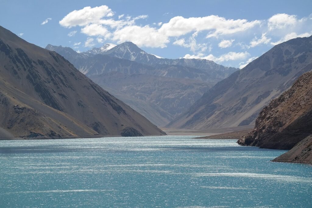 Sweeping panorama of the Andes mountains, their snow-capped peaks piercing the vivid blue sky. Lush, rolling foothills dotted with scrubby vegetation in shades of green, gold, and ochre. In the distance, the shimmering waters of a vast, turquoise lake reflect the dramatic landscape. In the foreground, the rugged, sun-bleached terrain of the Galápagos Islands, their unique volcanic formations and sparse, hardy flora. Warm, golden light bathes the entire scene, evoking the heat and dryness of the South American June dry season. Crisp, detailed, ultra-realistic photographic quality. Sweeping panorama of the Andes mountains, their snow-capped peaks piercing the vivid blue sky. Lush, rolling foothills dotted with scrubby vegetation in shades of green, gold, and ochre. In the distance, the shimmering waters of a vast, turquoise lake reflect the dramatic landscape. In the foreground, the rugged, sun-bleached terrain of the Galápagos Islands, their unique volcanic formations and sparse, hardy flora. Warm, golden light bathes the entire scene, evoking the heat and dryness of the South American June dry season. Crisp, detailed, photographic quality,
chile, mountains, lake, landscape, nature, sunshine, south america, chile, chile, mountains, mountains, lake, lake, landscape, nature, nature, nature, sunshine, sunshine, sunshine, sunshine, sunshine, south america, south america, south america,