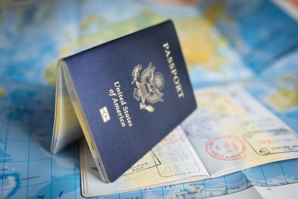 A highly detailed, ultra-realistic photograph showcasing the concept of a Schengen visa. In the foreground, a passport lies open, revealing the visa sticker and relevant information. The middle ground features various travel documents, airline tickets, and a world map, illustrating the international scope of Schengen travel. The background softly depicts famous European landmarks, such as the Eiffel Tower and the Colosseum, suggesting the diverse destinations accessible with a Schengen visa. The lighting is warm and natural, highlighting the official and authoritative nature of the Schengen visa system. The composition is carefully balanced, drawing the viewer's eye to the key elements and conveying the meaning, categories, and rules of the Schengen visa. photograph showcasing the concept of a Schengen visa. In the foreground, a passport lies open, revealing the visa sticker and relevant information. The middle ground features various travel documents, airline tickets, and a world map, illustrating the international scope of Schengen travel. The background softly depicts famous European landmarks, such as the Eiffel Tower and the Colosseum, suggesting the diverse destinations accessible with a Schengen visa. The lighting is warm and natural, highlighting the official and authoritative nature of the Schengen visa system. The composition is carefully balanced, drawing the viewer's eye to the key elements and conveying the meaning, categories, and rules of the Schengen visa.