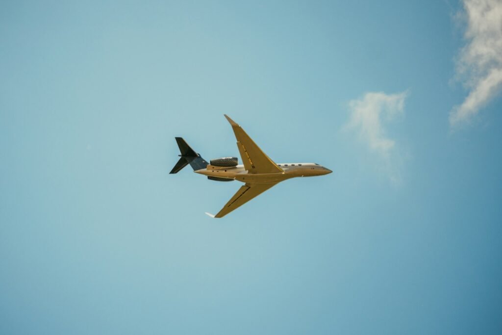 A luxurious private jet soars gracefully against a vibrant sunset sky, its sleek silhouette conveying the sophisticated allure of charter air travel. In the foreground, a well-appointed cabin interior showcases plush leather seating, polished wood accents, and state-of-the-art amenities, inviting the viewer to imagine the comfort and convenience of this bespoke travel experience. The mid-ground features a gleaming tarmac, with ground crews efficiently handling luggage and preparing the aircraft for departure, highlighting the seamless efficiency of the charter process. The background is a panoramic vista of the airport, with towering control towers and hangar facilities suggesting the scale and infrastructure that enables the value proposition of private air travel. The lighting is soft and warm, conveying a sense of luxury and exclusivity, while the lens captures the scene with cinematic clarity and depth of field. A luxurious private jet soars gracefully against a vibrant sunset sky, its sleek silhouette conveying the sophisticated allure of charter air travel. In the foreground, a well-appointed cabin interior showcases plush leather seating, polished wood accents, and state-of-the-art amenities, inviting the viewer to imagine the comfort and convenience of this bespoke travel experience. The mid-ground features a gleaming tarmac, with ground crews efficiently handling luggage and preparing the aircraft for departure, highlighting the seamless efficiency of the charter process. The background is a panoramic vista of the airport, with towering control towers and hangar facilities suggesting the scale and infrastructure that enables the value proposition of private air travel. The lighting is soft and warm, conveying a sense of luxury and exclusivity, while the lens captures the scene with cinematic clarity and depth of field.