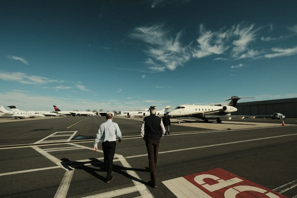 A picturesque scene of a private jet soaring through the sky, its sleek silhouette cutting through the clouds. In the foreground, a busy executive sits comfortably, laptop in hand, taking advantage of the uninterrupted time to work efficiently. In the middle ground, a family relaxes, enjoying the freedom and convenience of their private charter, unburdened by the constraints of commercial travel. The background showcases a serene landscape, hinting at the leisure opportunities afforded by the flexibility of private air travel. Soft, warm lighting illuminates the cabin, creating an atmosphere of productivity and relaxation. A high-resolution, ultra-realistic photo capturing the essence of time savings and scheduling flexibility for both business and leisure. A picturesque scene of a private jet soaring through the sky, its sleek silhouette cutting through the clouds. In the foreground, a busy executive sits comfortably, laptop in hand, taking advantage of the uninterrupted time to work efficiently. In the middle ground, a family relaxes, enjoying the freedom and convenience of their private charter, unburdened by the constraints of commercial travel. The background showcases a serene landscape, hinting at the leisure opportunities afforded by the flexibility of private air travel. Soft, warm lighting illuminates the cabin, creating an atmosphere of productivity and relaxation. A high-resolution, ultra-realistic photo capturing the essence of time savings and scheduling flexibility for both business and leisure.