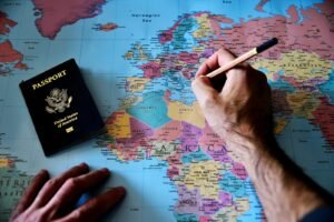europe trip planner, a person is writing on a map with a pencil