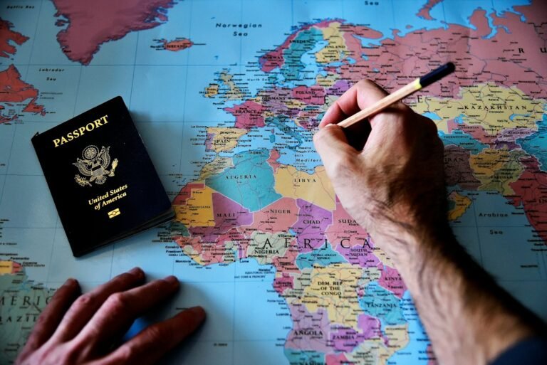 europe trip planner, a person is writing on a map with a pencil