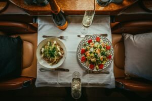 benefits of charter flights, a table with plates of food and glasses on it