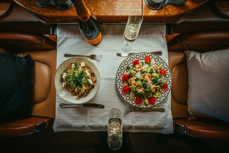 benefits of charter flights, a table with plates of food and glasses on it