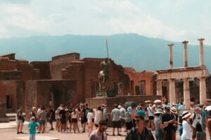 pompeii day tour, people standing near brown concrete building during daytime