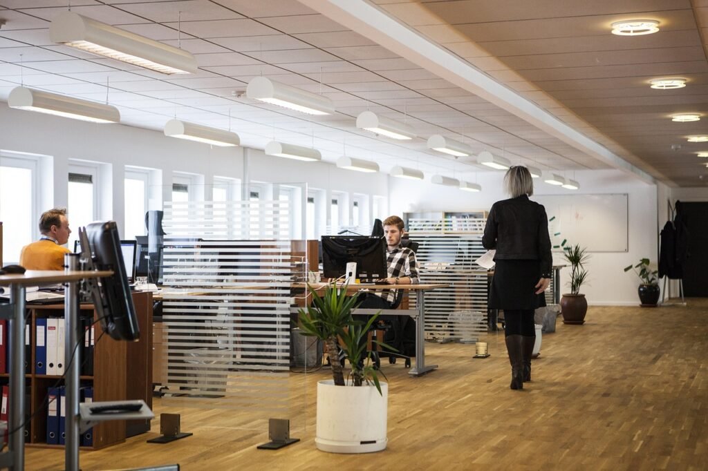 A panoramic photograph showcasing a sleek, modern office setting. In the foreground, several travel brochures for South American tours are neatly arranged on a glass conference table, each displaying vibrant imagery and enticing descriptions. The middle ground features representatives from various tour companies engaged in discussion, their expressions conveying expertise and professionalism. The background is filled with a large, floor-to-ceiling. The overall atmosphere exudes a sense of sophisticated elegance and authority, inviting the viewer to explore the captivating offerings of South American travel experiences.