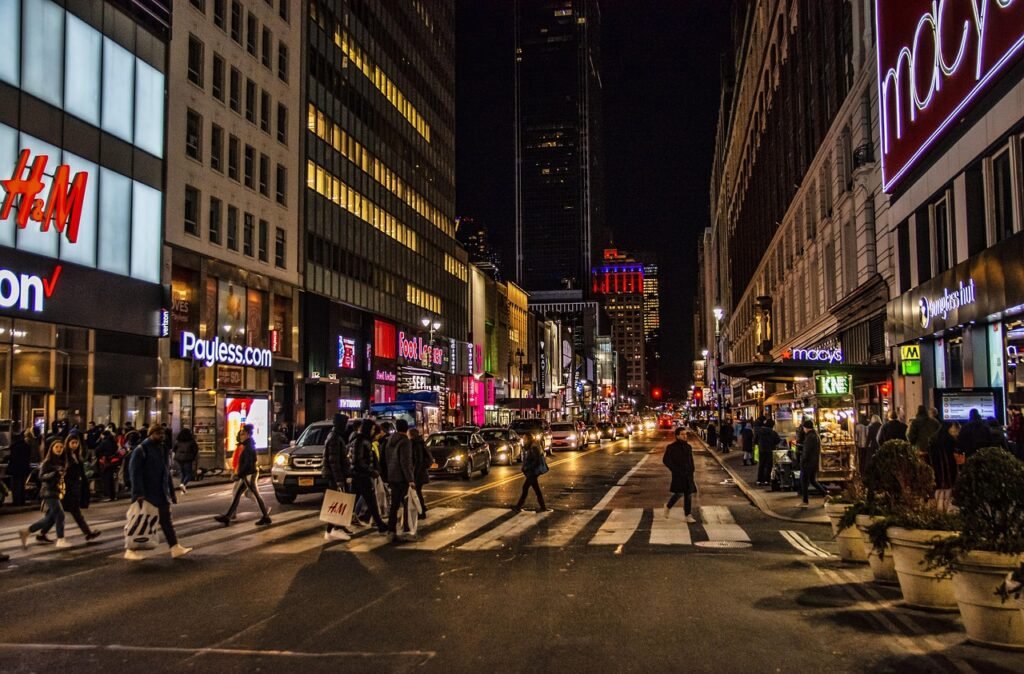 A bustling urban landscape, the iconic New York City delis and appetizing shops stand as timeless landmarks. In the foreground, a quintessential deli facade adorned with neon signs and awnings, showcasing an array of cured meats, freshly baked bagels, and overflowing platters of lox and cream cheese. Passersby weave through the crowded sidewalks, the aroma of freshly brewed coffee and sizzling pastrami enticing them inside. In the middle ground, the storefronts of celebrated appetizing shops, their windows displaying an abundance of smoked fish, caviar, and other delectable delicacies. The backdrop is a bustling city street, with iconic yellow taxis, towering skyscrapers, and the electric energy of New York City. Warm, directional lighting illuminates the scene, capturing the vibrant, authentic essence of these beloved culinary institutions. An ultra-realistic, meticulously detailed photographic depiction. A bustling urban landscape, the iconic New York City delis and appetizing shops stand as timeless landmarks. In the foreground, a quintessential deli facade adorned with neon signs and awnings, showcasing an array of cured meats, freshly baked bagels, and overflowing platters of lox and cream cheese. Passersby weave through the crowded sidewalks, the aroma of freshly brewed coffee and sizzling pastrami enticing them inside. In the middle ground, the storefronts of celebrated appetizing shops, their windows displaying an abundance of smoked fish, caviar, and other delectable delicacies. The backdrop is a bustling city street, with iconic yellow taxis, towering skyscrapers, and the electric energy of New York City. Warm, directional lighting illuminates the scene, capturing the vibrant, authentic essence of these beloved culinary institutions. An ultra-realistic, meticulously detailed photographic depiction.