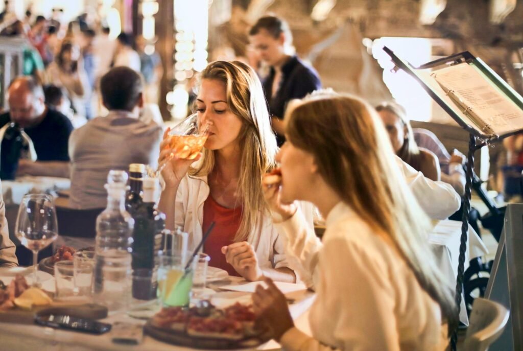 A bustling Parisian street, lined with quaint cafes and artisan shops, sets the stage for a culinary adventure beyond the typical tourist trail. In the foreground, a group of enthusiastic food and wine connoisseurs gather, eager to explore the city's hidden gastronomic gems. The middle ground showcases a diverse array of local delicacies, from freshly baked baguettes to artisanal cheese platters, complemented by a selection of fine French wines. In the background, the iconic Eiffel Tower stands tall, lending a timeless elegance to the scene. The lighting is warm and inviting, capturing the essence of a true Parisian culinary experience. An ultra-realistic, high-resolution photograph that immerses the viewer in the sights, sounds, and flavors of this unique Paris food and wine tour. A bustling Parisian street, lined with quaint cafes and artisan shops, sets the stage for a culinary adventure beyond the typical tourist trail. In the foreground, a group of enthusiastic food and wine connoisseurs gather, eager to explore the city's hidden gastronomic gems. The middle ground showcases a diverse array of local delicacies, from freshly baked baguettes to artisanal cheese platters, complemented by a selection of fine French wines. In the background, the iconic Eiffel Tower stands tall, lending a timeless elegance to the scene. The lighting is warm and inviting, capturing the essence of a true Parisian culinary experience. An ultra-realistic, high-resolution photograph that immerses the viewer in the sights, sounds, and flavors of this unique Paris food and wine tour.