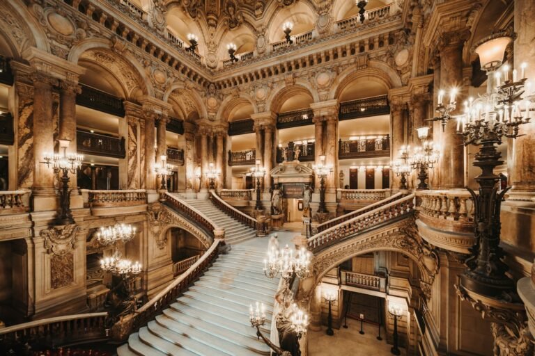 luxury european tours, a grand staircase with chandeliers and chandeliers