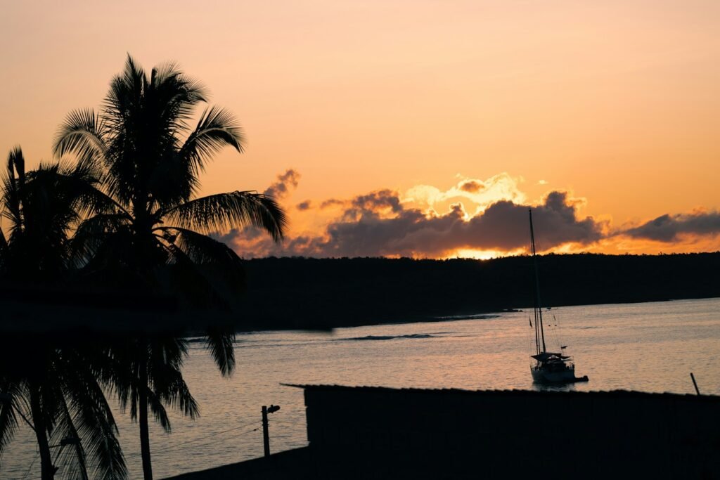 Golden Galapagos sunset over calm waters during the warm season — showcasing why timing matters when choosing the best time of year to visit Galapagos.