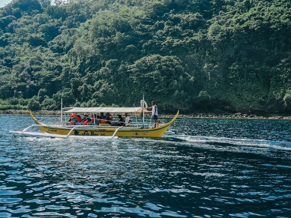 Luxury travelers exploring the Peru Amazon River on a guided rainforest boat tour.